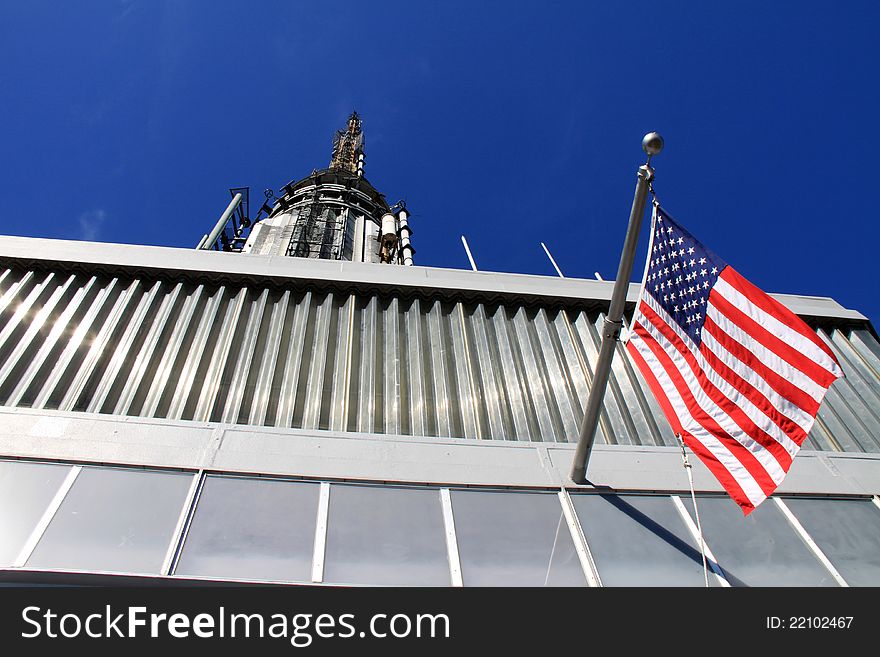 A top of a tower with flag. A top of a tower with flag