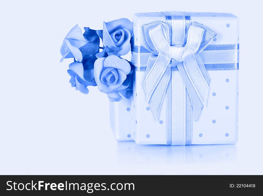 Present box for jewelery with ribbon bow decor and flower boutonniere. Blue colored image. Present box for jewelery with ribbon bow decor and flower boutonniere. Blue colored image