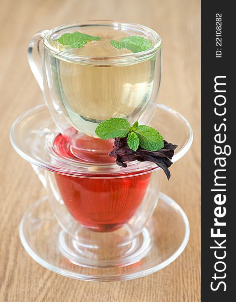 Mint tea and tea Hibiscus on a wooden background