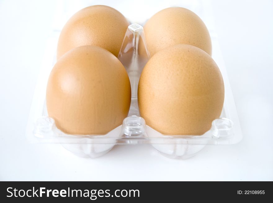 Eggs in clear pack on white background