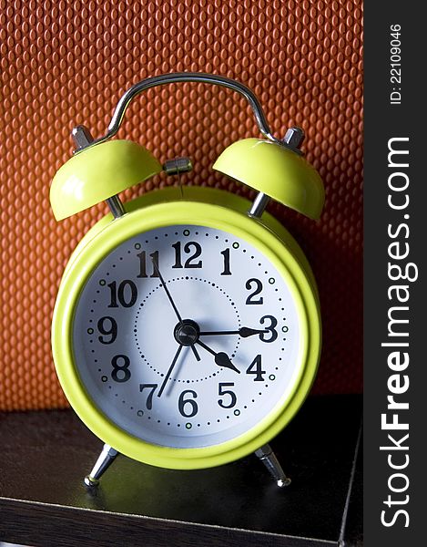 Light green color alarm clock with color background. Light green color alarm clock with color background