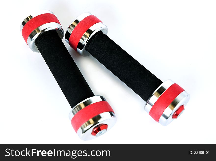 Healthy life concept red dumbbells on white background