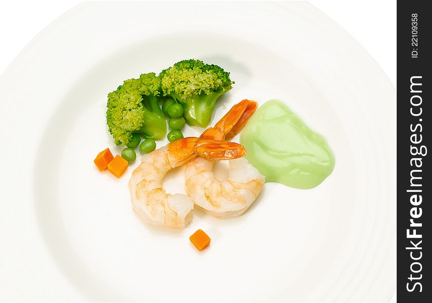 Clean and great taste of shrimps seafood menu display on dish with gravy broccoli and green pea. Clean and great taste of shrimps seafood menu display on dish with gravy broccoli and green pea