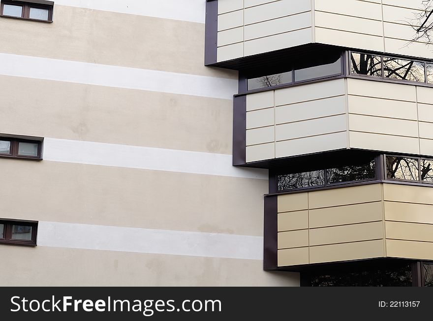 The facade of a modern building with balconies. The facade of a modern building with balconies