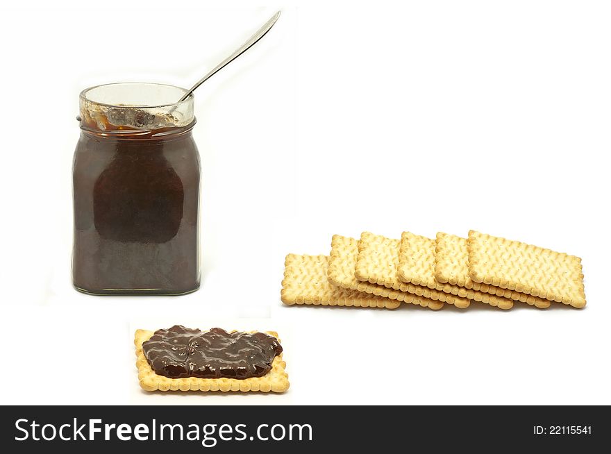 Jar and biscuits on white background