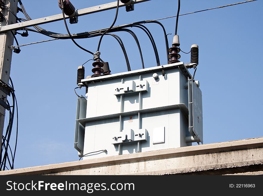 Electrical post by the road with power line cables, transformers and phone lines. Electrical post by the road with power line cables, transformers and phone lines