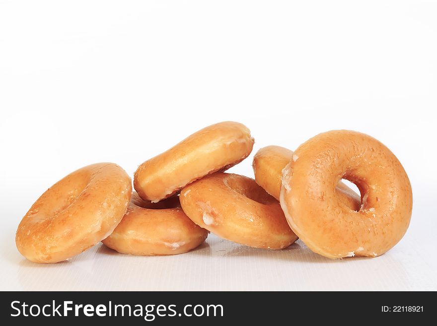 Sweet creamy soft brown donuts  on white background