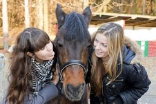 Two Girls Playing With Horse Royalty Free Stock Image Two Girls Playing With Horse Royalty Free Stock Image