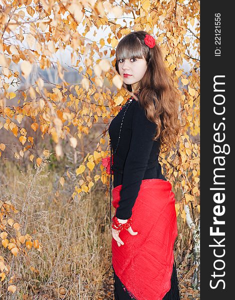 Young pretty girl over autumnal background. Young pretty girl over autumnal background