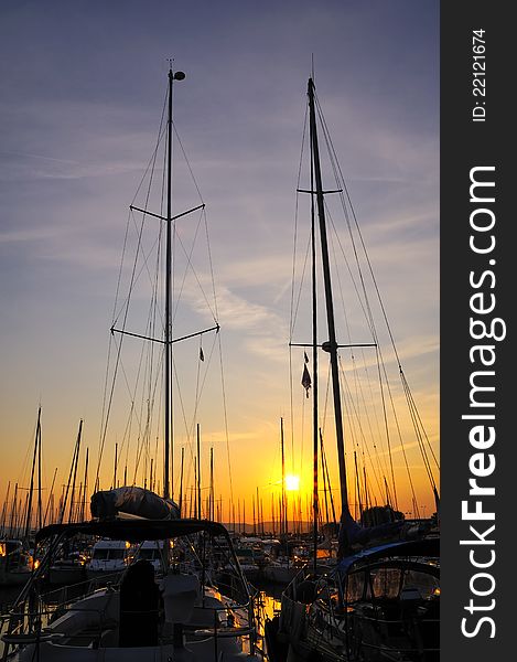 Marina and a forest of tall mast at sunset. Marina and a forest of tall mast at sunset