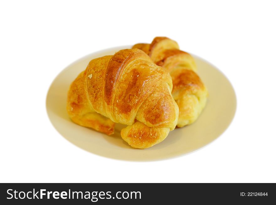 Two fresh croissant ,casting soft whadow on white. Two fresh croissant ,casting soft whadow on white.