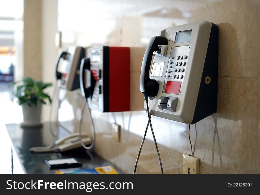 Three public telephone on wall