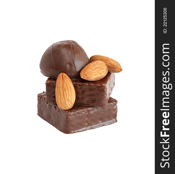 Sweet dessert. Stack of chocolate and almonds on white background. Isolated with clipping path. Sweet dessert. Stack of chocolate and almonds on white background. Isolated with clipping path