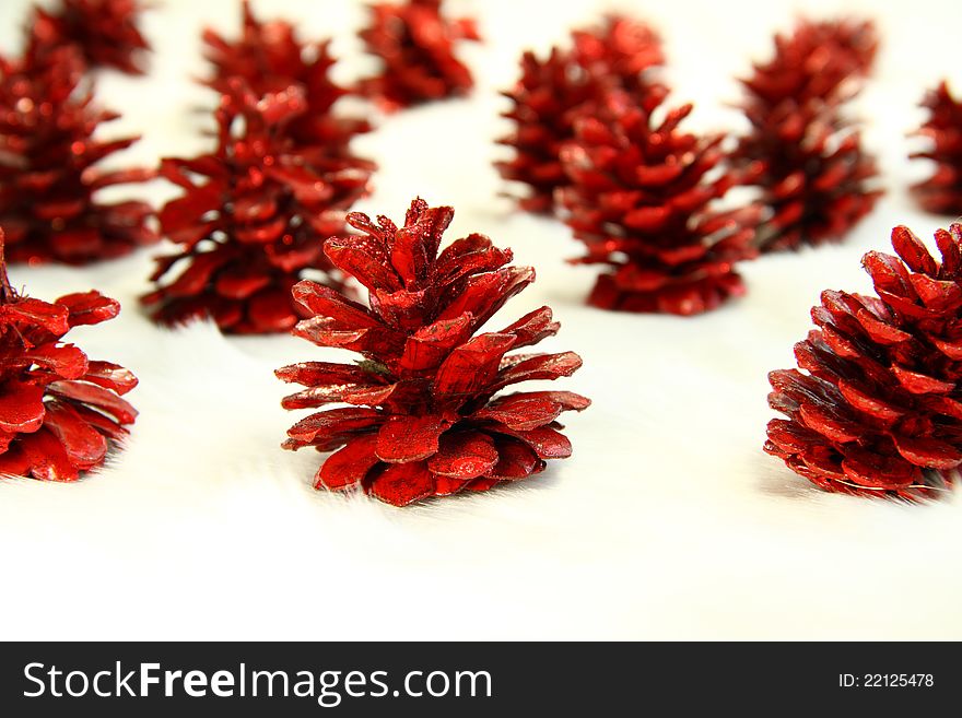 A forest of Red Christmas Pine cones on a soft background.