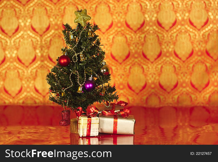 A christmas tree with a star and presents under tree. A christmas tree with a star and presents under tree