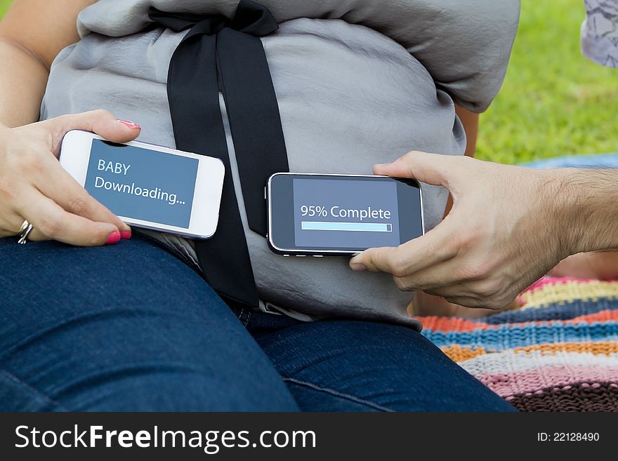Expecting mom and dad holding smart phones. Expecting mom and dad holding smart phones