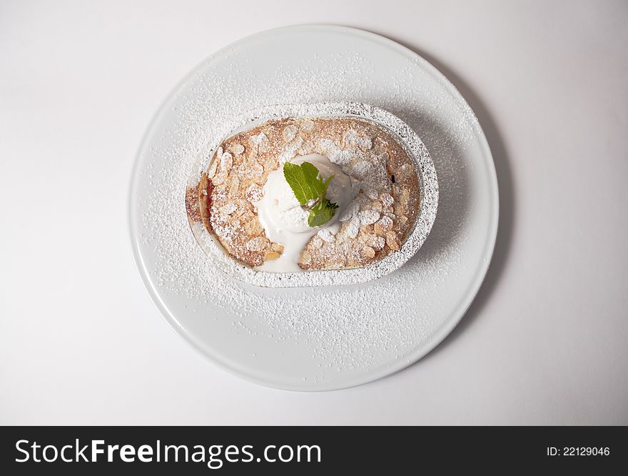 Apple pie with ice cream and mint