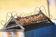 Grilled Sausage Over A Hot Barbecue Grill. Stock Photos