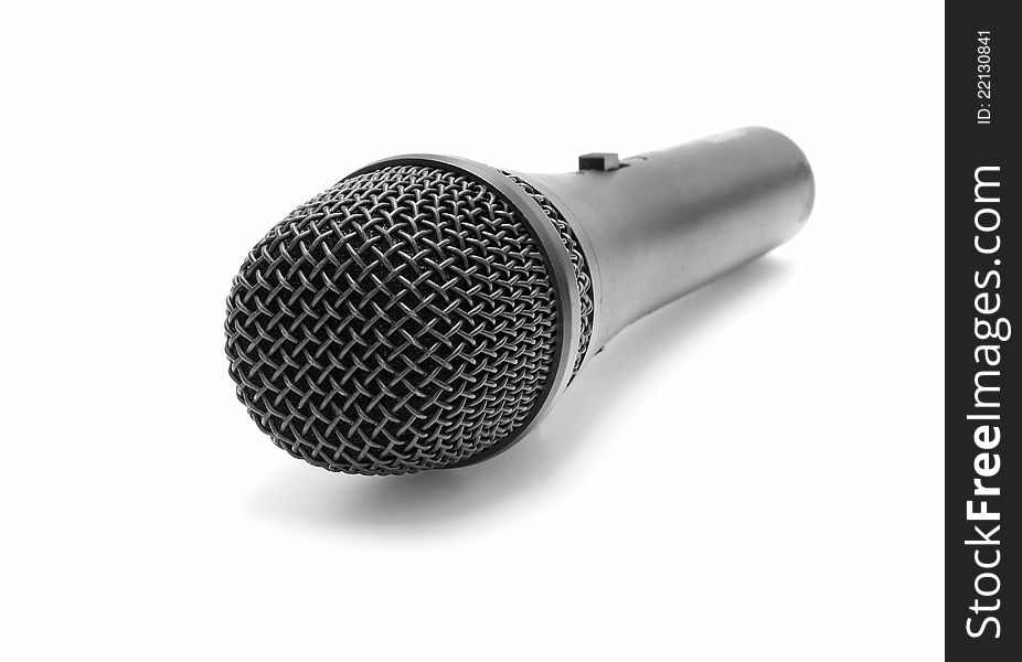 Black microphone on white background