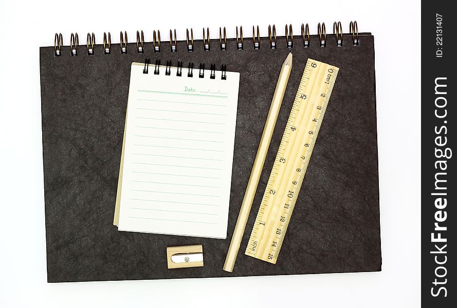 School accessories and notebooks on white background