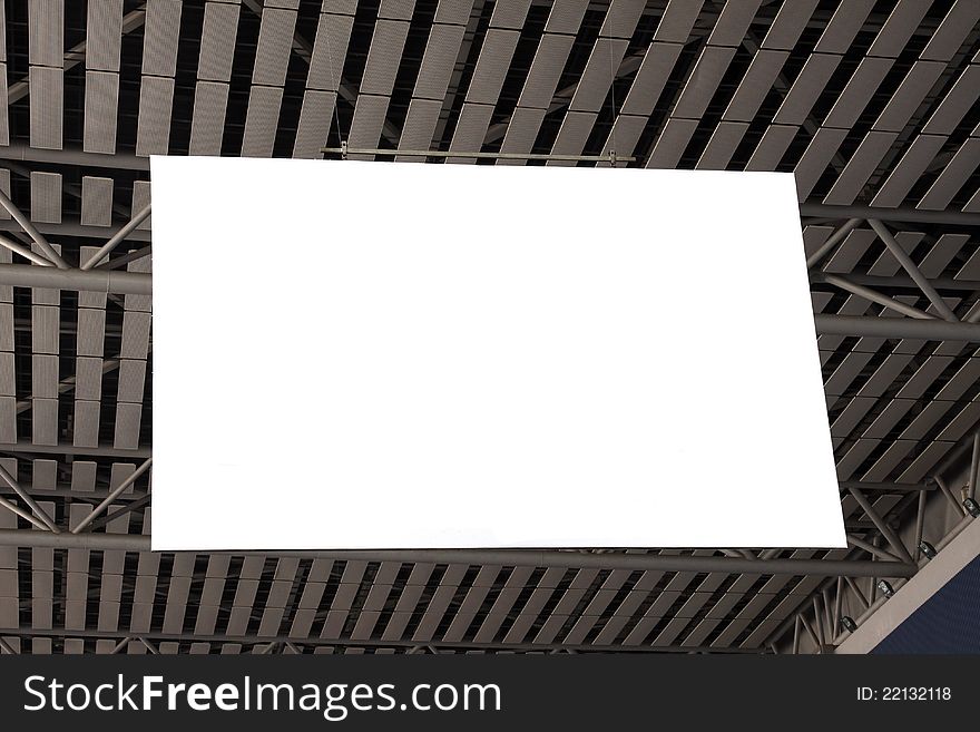 A blank billboard hanging on the ceiling of the exhibition hall. A blank billboard hanging on the ceiling of the exhibition hall.