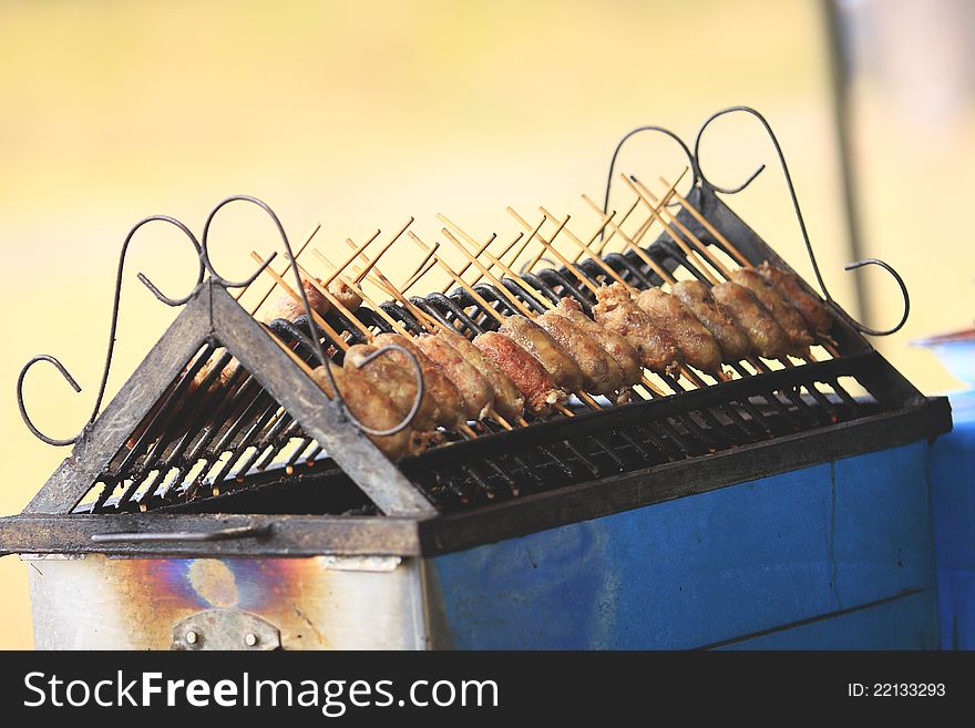 Grilled sausage over a hot barbecue grill in Phukradung National Park. Grilled sausage over a hot barbecue grill in Phukradung National Park.