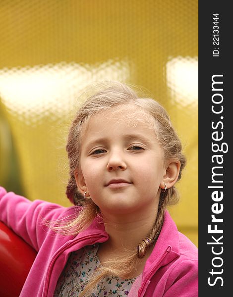 Portrait of blond girl smiling outside autumn day