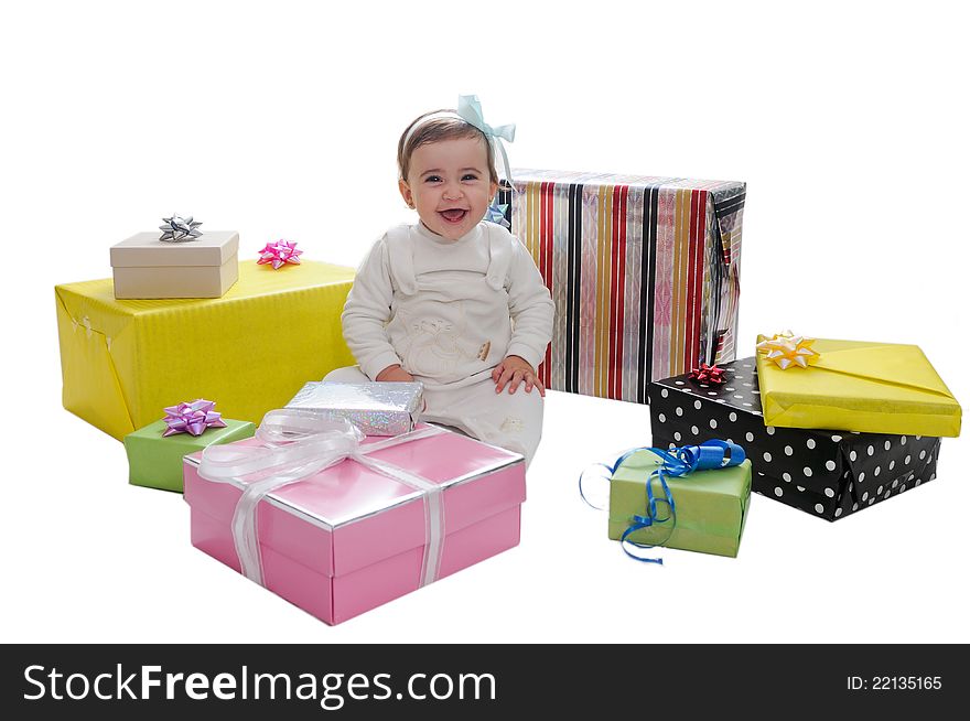 Nine months baby girl with gifts. Isolated on white background