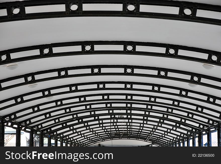 Background with curved roof with metallic structure