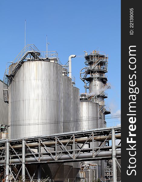 Refinery plant with tanks, pipes and cooling towers