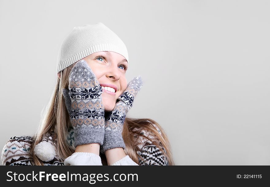 Beautiful young smiling woman in a knitted sweater. Beautiful young smiling woman in a knitted sweater