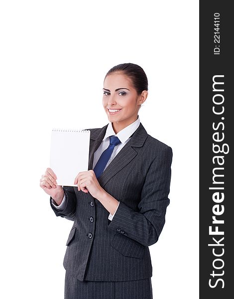Young businesswoman pointing into empty blank and smiling