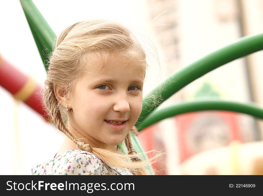 Portrait Of A Girl On A Swing Against