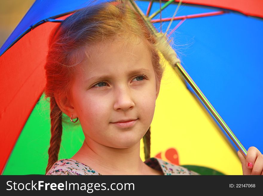 Portrait of little girl with a smile and an umbrella day fall. Portrait of little girl with a smile and an umbrella day fall