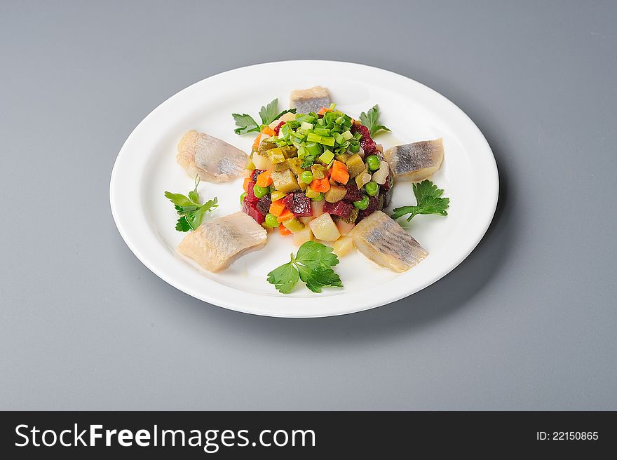 Russian salad with beetroot and herring