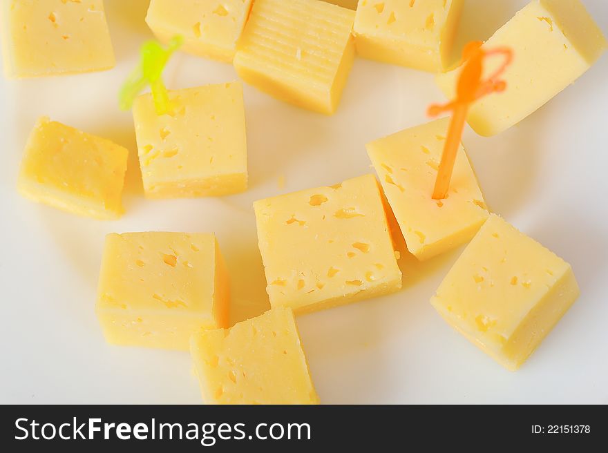 Gauda cheese cubes on plate