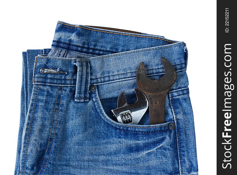 Blue jeans pocket with old tool on white background