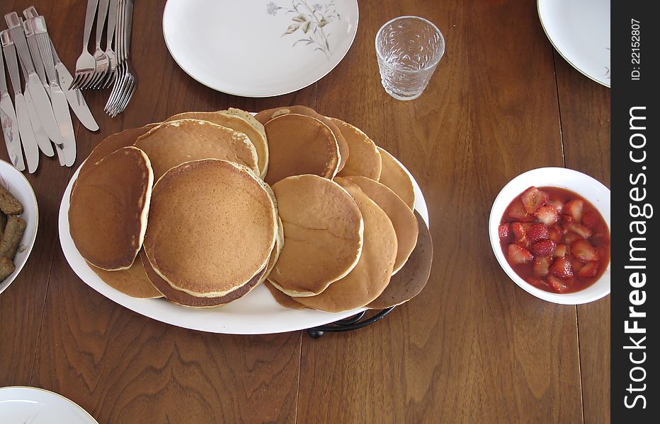 Perfect morning breakfast meal of pancakes with strawberries. Perfect morning breakfast meal of pancakes with strawberries