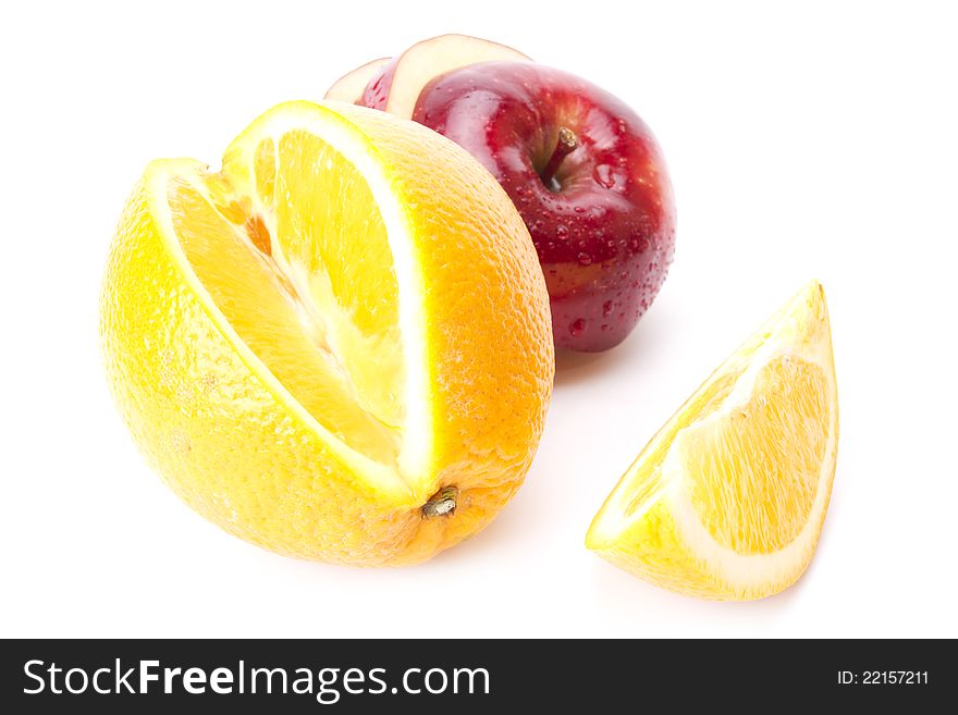 Cut orange and sliced red apple isolated on white screen. Cut orange and sliced red apple isolated on white screen.