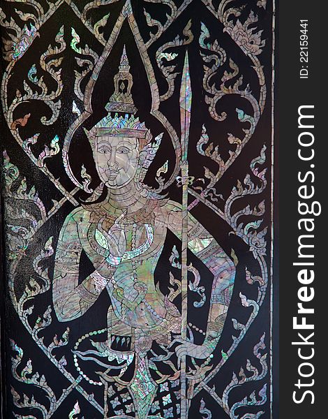 Beautiful Decorate Art on Black door at Wat Mai Sam Ran, Chonburi Thailand