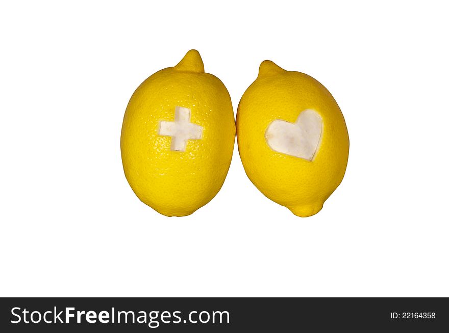 Two ripe lemons isolated on white.