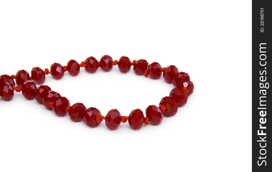 Necklace made of red beads isolated on white