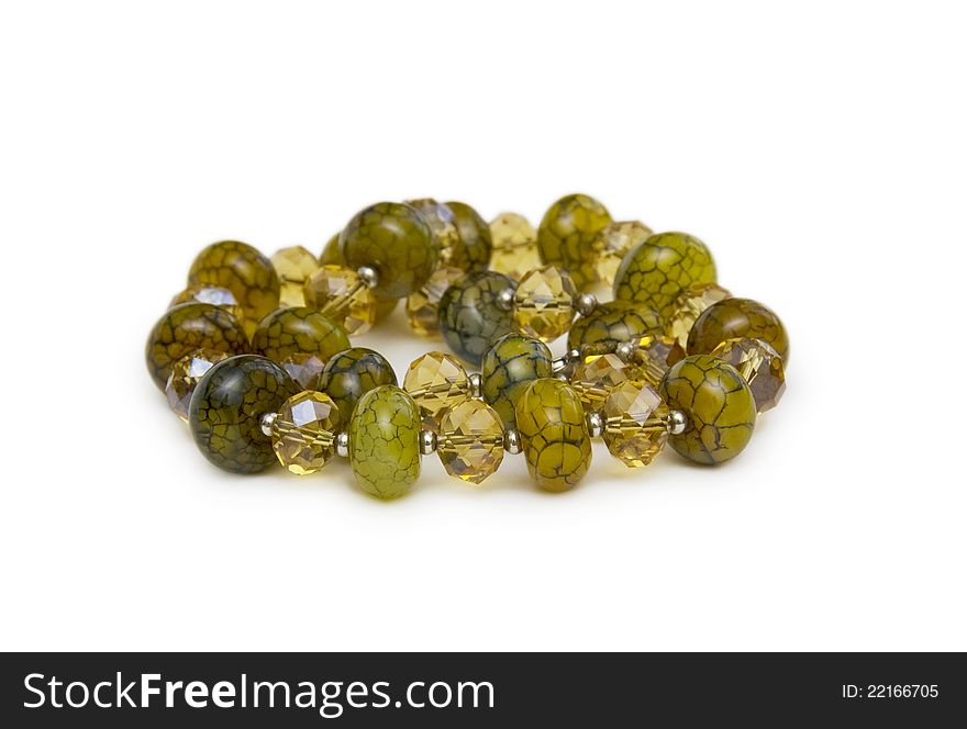 Necklace made of green  beads isolated on white