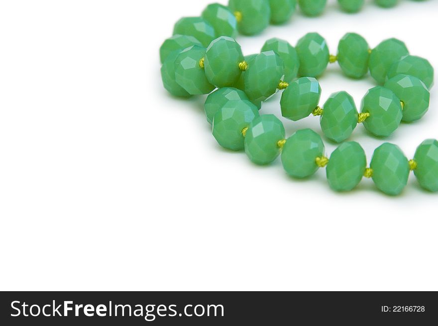 Necklace made of green beads isolated on white
