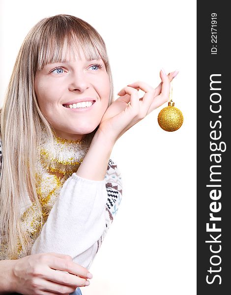 Beautiful woman holding a Christmas toy on white background. Beautiful woman holding a Christmas toy on white background