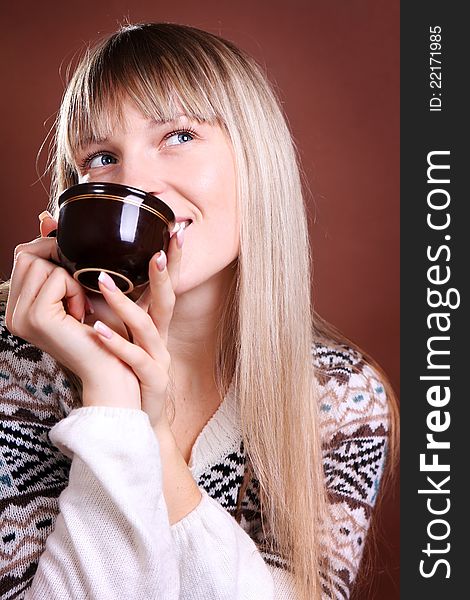 Beautiful smiling woman with a cup of coffee. Beautiful smiling woman with a cup of coffee