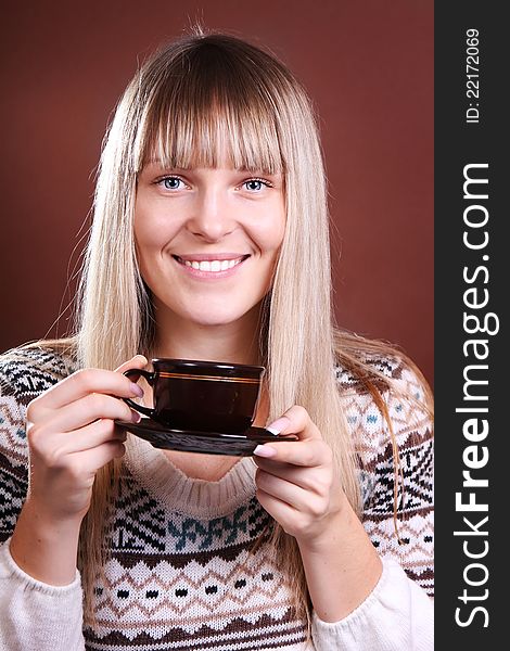 Beautiful smiling woman with a cup of coffee. Beautiful smiling woman with a cup of coffee