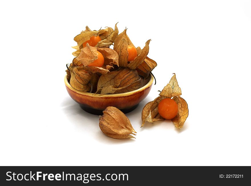 Husk tomatoes on a small plate