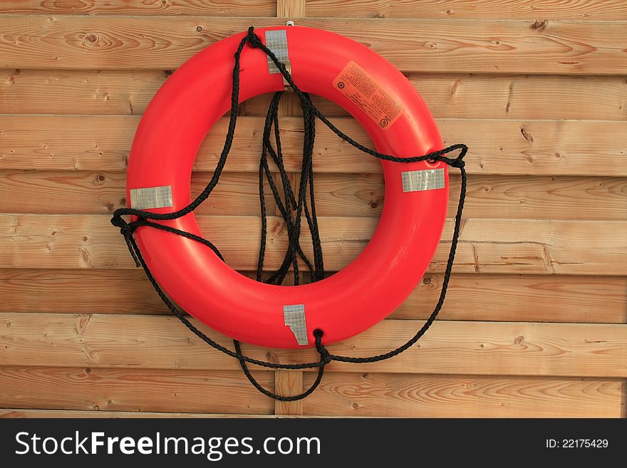 Colorful lafe saver hanging by a pool. Colorful lafe saver hanging by a pool