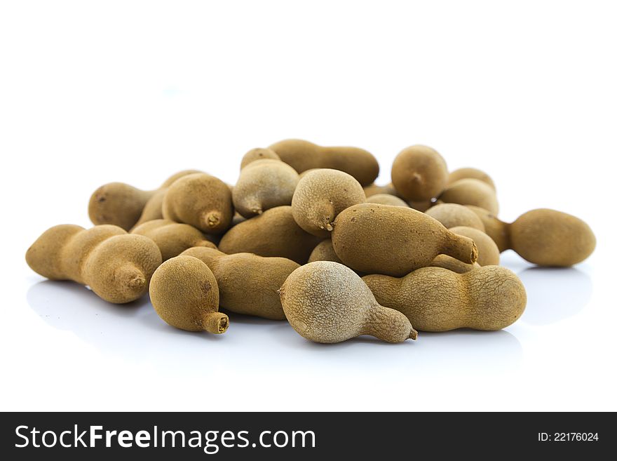 Sweet tamarind, exotic fruit, on white table